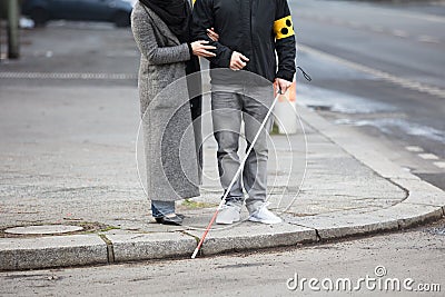 Woman With A Blind Man On Street Stock Photo