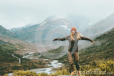 Woman bliss emotional raised hands foggy mountains Stock Photo