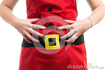 Woman with bloated stomach grabbing abdominal area Stock Photo