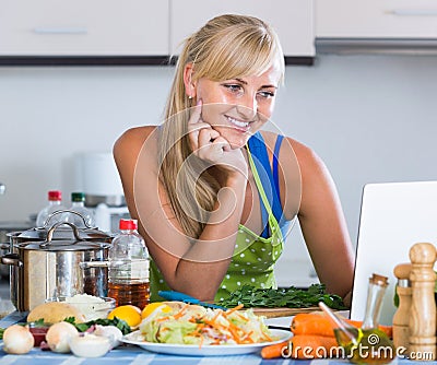 Woman blogging about culinary from home notebook Stock Photo