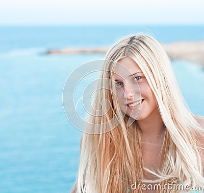 Woman with blond hair enjoying seaside and beach lifestyle in summertime, holiday travel and leisure Stock Photo