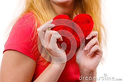 Woman blonde girl holding red heart love symbol Stock Photo