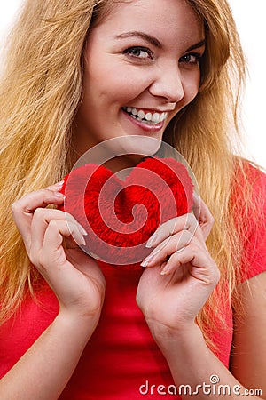 Woman blonde girl holding red heart love symbol Stock Photo