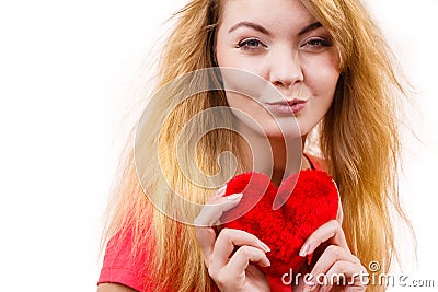 Woman blonde girl holding red heart love symbol Stock Photo