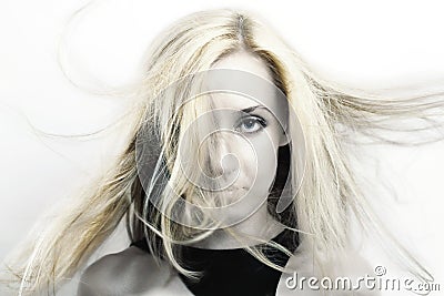 Woman with blonde hair flutter in the wind Stock Photo