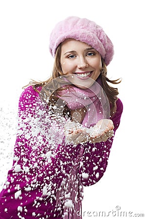 Woman blow snowflakes from hands Stock Photo