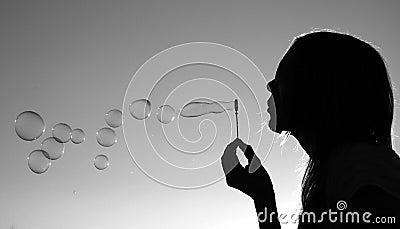 Woman Blowing Bubbles Stock Photo