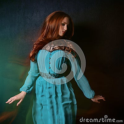 Woman in a blue dress Stock Photo