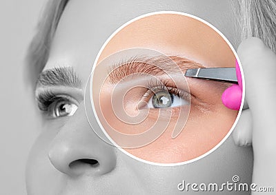 Woman with blue eyes having Permanent Make-up Tattoo on her Eyebrows. Eyelash artist plucks eyebrows with tweezers. Professional Stock Photo