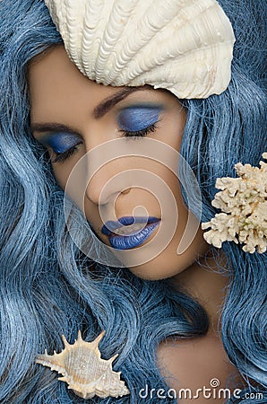 Woman with blue hair and seashells Stock Photo