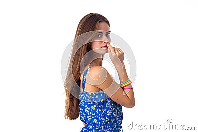 Woman in blue T-shirt standing sidewise Stock Photo