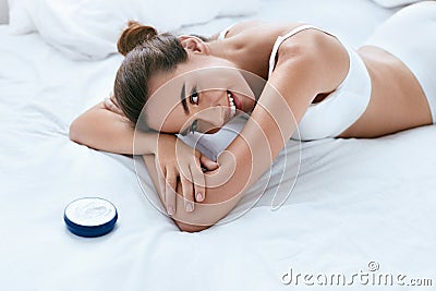 Woman Body Skin Care. Beautiful Smiling Girl With Cream Stock Photo