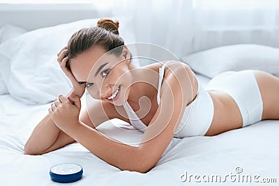 Woman Body Skin Care. Beautiful Smiling Girl With Cream Stock Photo