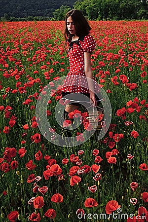 Woman with books, education, business, grammar. Poppy, Remembrance day, Anzac. Young woman with book in poppy flower Stock Photo