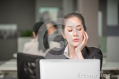 Woman bored after work, unmotivated employee feels disinterested, asian business girl with boring working moment Stock Photo