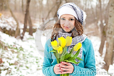 Woman with a bouquet of flowers at the park Stock Photo