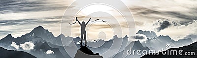 Woman breaks her chains on a mountain peak Stock Photo