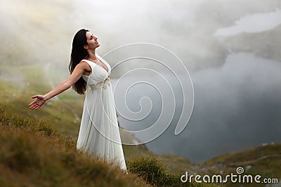 Woman breathing fresh mountain air Stock Photo