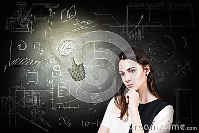 Woman and bright bulb over icons background. Stock Photo