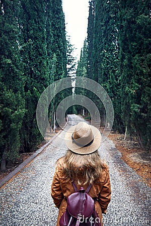 Tourist in hat at cypress alley Stock Photo