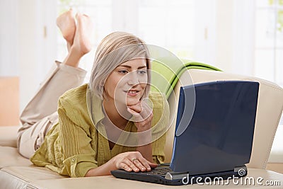 Woman browsing internet at home Stock Photo