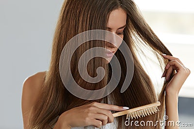 Woman Brushing Beautiful Healthy Long Hair With Brush Portrait Stock Photo