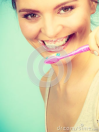 Woman brushing cleaning teeth Stock Photo
