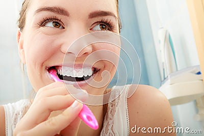 Woman brushing cleaning teeth. Oral hygiene. Stock Photo