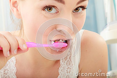 Woman brushing cleaning teeth. Oral hygiene. Stock Photo