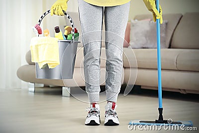 Woman with bucket and sanitary items cleanup the room,hosework,housekeeping concept Stock Photo