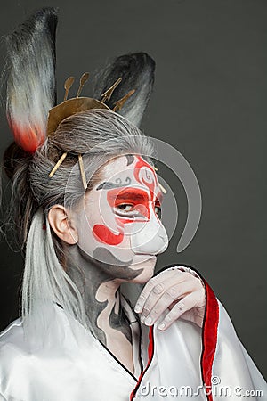 Woman in bunny or hare mask portrait. Halloween, Carnival and Cosplay concept Stock Photo