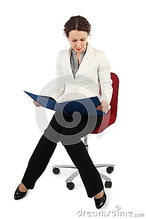 Woman in business dress sitting and read Stock Photo