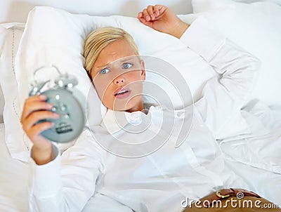 Woman, business or late alarm clock, bedroom or home with urgent appointment, professional or career. Person, employee Stock Photo