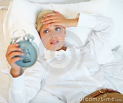 Woman, business and late alarm clock, bedroom and home with urgent appointment, wake up time and career. Person Stock Photo
