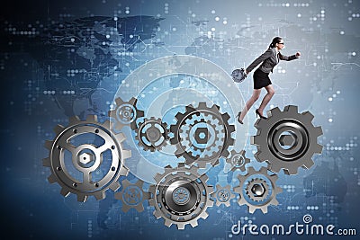 The woman businesswoman walking in cogwheels Stock Photo