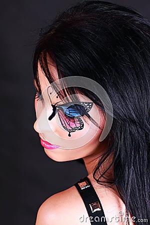 Woman with butterfly makeup Stock Photo