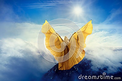 Woman Butterfly Wings Flying in Sky Clouds, Girl Standing on Mountain Peak, in Flight to Sun Stock Photo