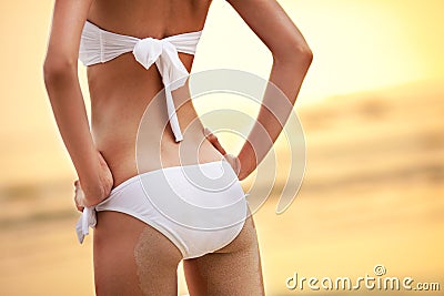 Woman buttocks on tropical beach Stock Photo