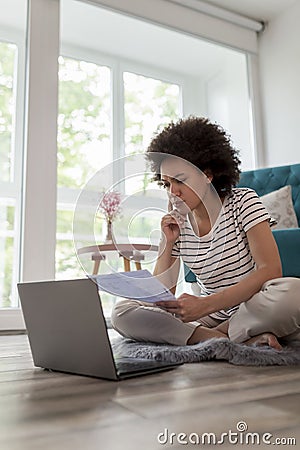 Woman calculating bank loan payout rates Stock Photo