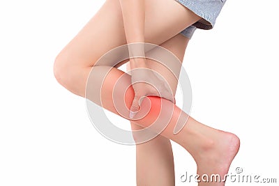 Woman with calf feeling pain on white background. Stock Photo