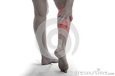 Woman with calf feeling pain on white background Stock Photo