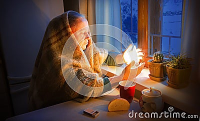 Woman with candles. Power outage in Kyiv Stock Photo