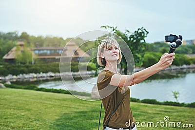 Woman capturing herself with personal camera Stock Photo
