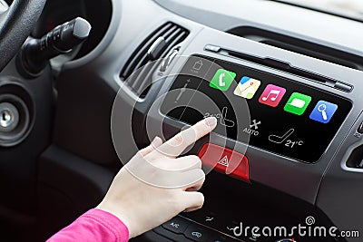 Woman in a car and touch play finger in auto smart system Stock Photo