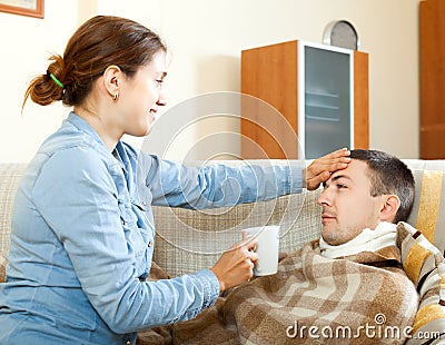 Woman caring for sick man Stock Photo