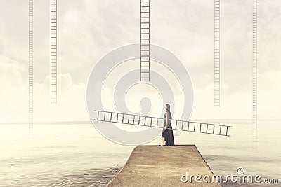 Woman carries her personal ladder to climb into the sky Stock Photo