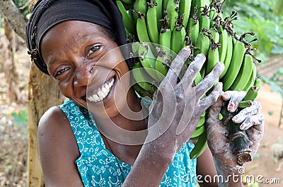 Woman carrying bananas, Tanzania Editorial Stock Photo
