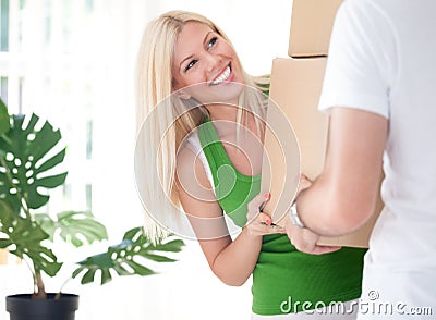 Woman carrying box with boyfriend Stock Photo