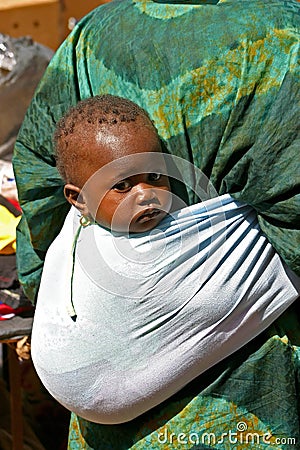 Woman carrying child in Mali Editorial Stock Photo