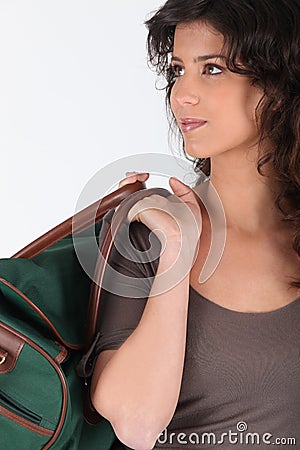 Woman carrying a duffel bag Stock Photo